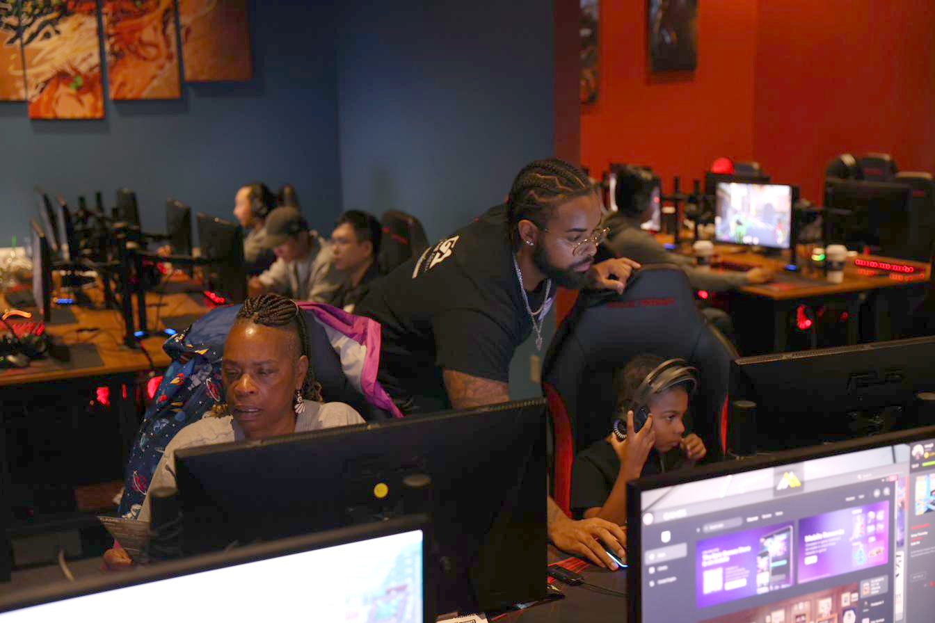 A senior player focused at their station during a session